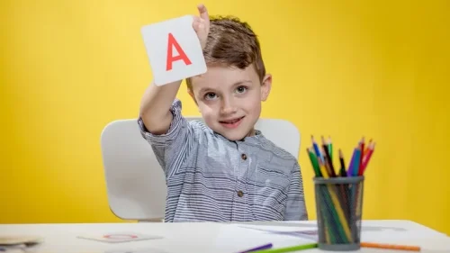 happy-smiling-little-preschool-boy-shows-letters-home-making-homework-morning-before-school-starts_130265-8391_11zon