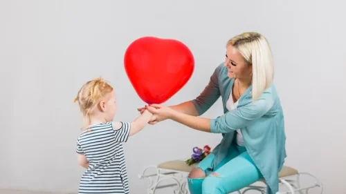 mother-daughter-holding-red-heart-balloon_23-2148082269_11zon